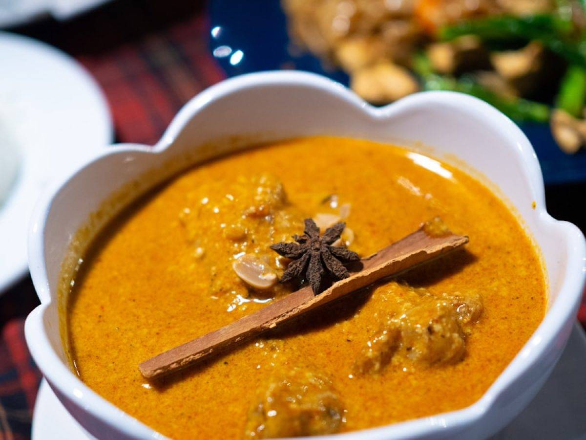 a bowl of soup with a spoon in it