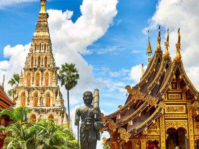 standing statue and temples landmark during daytime