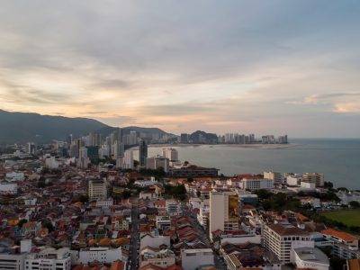 city skyline under white clouds during daytime