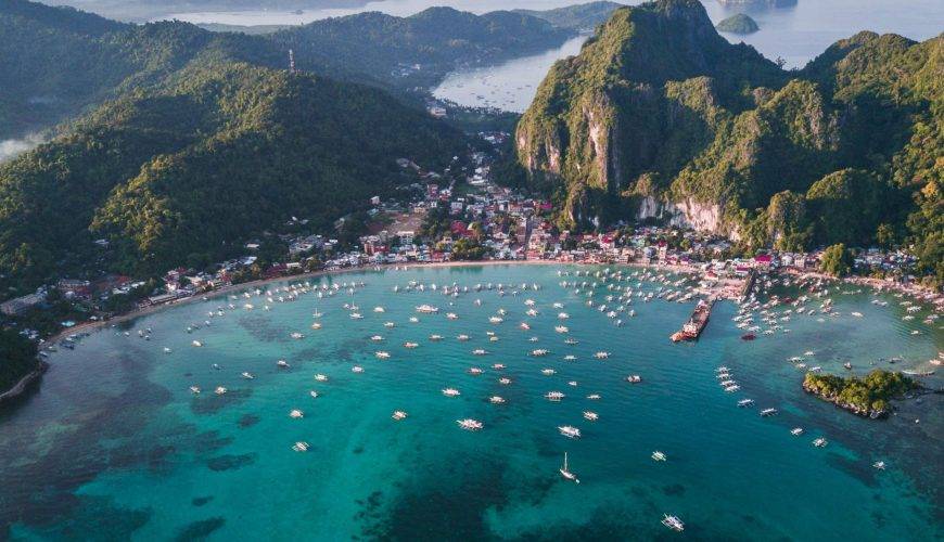 landscape photography of island with boats