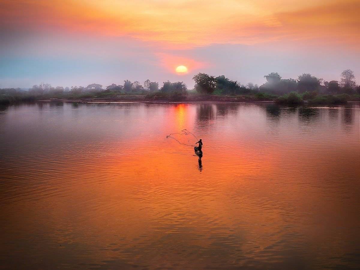 body of water during sunset