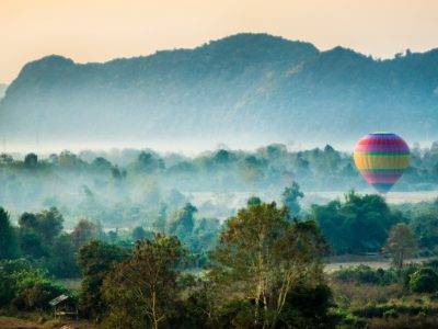 time lapse photography of flying hot air balloon