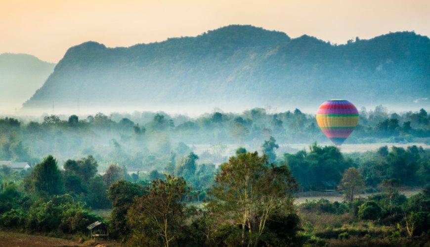 time lapse photography of flying hot air balloon