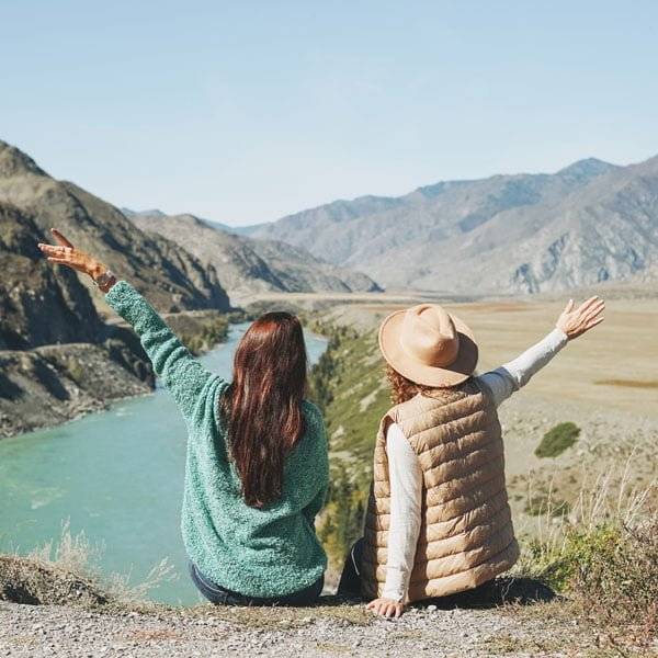 young-women-travellers-friends-on-background-of-tu-2021-08-29-12-59-57-utc